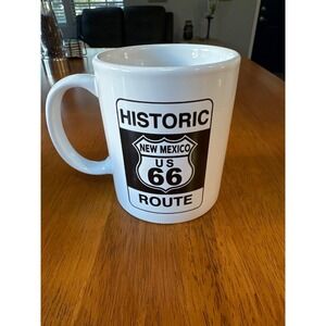 Route 66 coffee cup with handle. White with black writing.